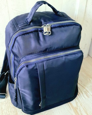 Rucsac albastru din material textil impermeabil cu buzunar antifurt cu fermoar si suport  pentru troler  ACRD209