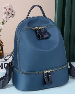 Rucsac dama albastru fashion din material textil impermeabil si buzunar orizontal ACRD354