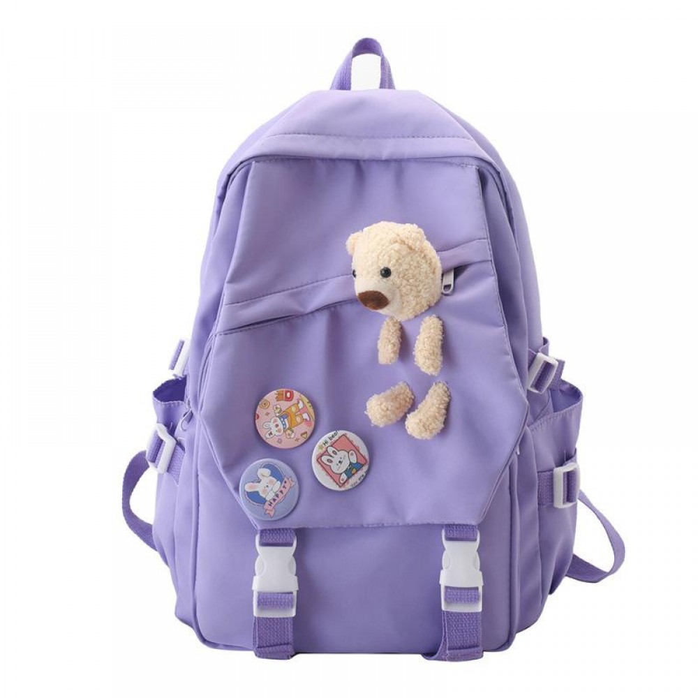 Ghiozdan tip Rucsac lila din material textil impermebail cu buzunare accesoriu insigne si ursulet ACRD375 Ghiozdan tip Rucsac lila din material textil impermebail cu buzunare accesoriu insigne si ursulet ACRD375