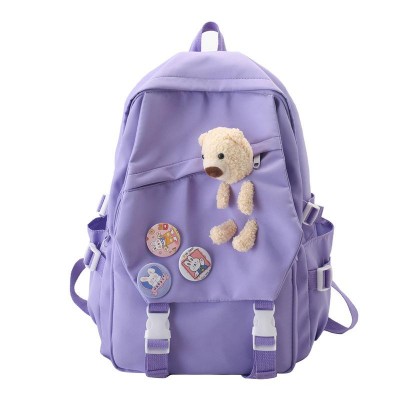 Ghiozdan tip Rucsac lila din material textil impermebail cu buzunare accesoriu insigne si ursulet ACRD375