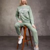 Trening Dama sport casual verde fistic compus din bluza scurta si pantaloni de trening cu talie inalta TND072 Trening Dama sport casual verde fistic compus din bluza scurta si pantaloni de trening cu talie inalta TND072